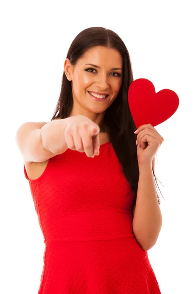 Woman in love wearing red dress holding red heart sending messag — Stock Photo, Image