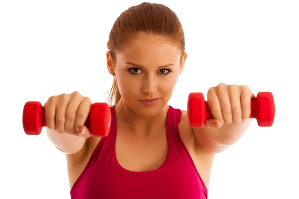 Fitness gym - woman works out with dumbbells isolated over white — Stock Photo, Image