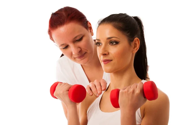 Physiotherapy - therapist doing arm  excercises with dumbbells f — Stock Photo, Image