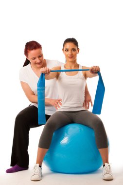 Physiotherapy - therapist doing arm strenghteninh excercises wit clipart