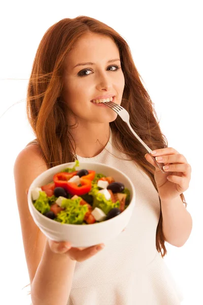 Alimentação saudável - mulher come uma tigela de salada grega isolada sobre — Fotografia de Stock