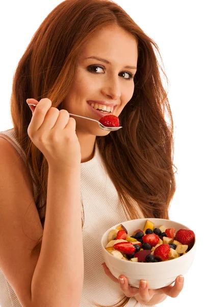 Healthy eating  - woman eats a bowl of fruit salad isolated over — Stock Photo, Image