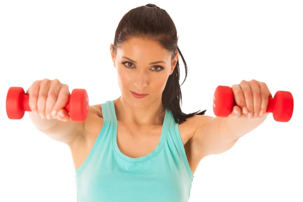 Actieve vrouw met halters training in de fitnessruimte geïsoleerd via — Stockfoto