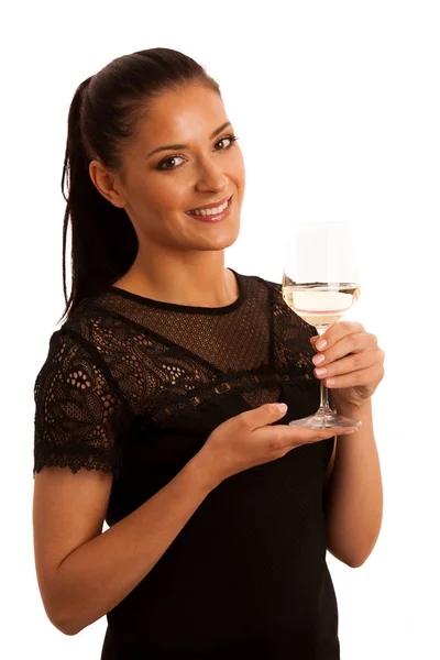 Young brunette woman with a glass of white wine — Stock Photo, Image