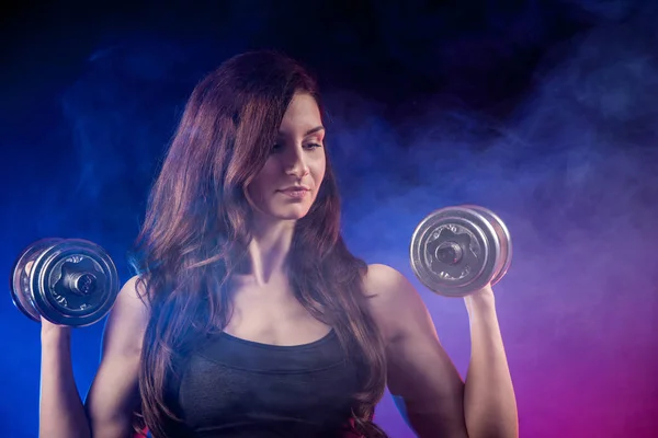 Atractive fit woman works out with dumbbells as a fitness concep — Stock Photo, Image