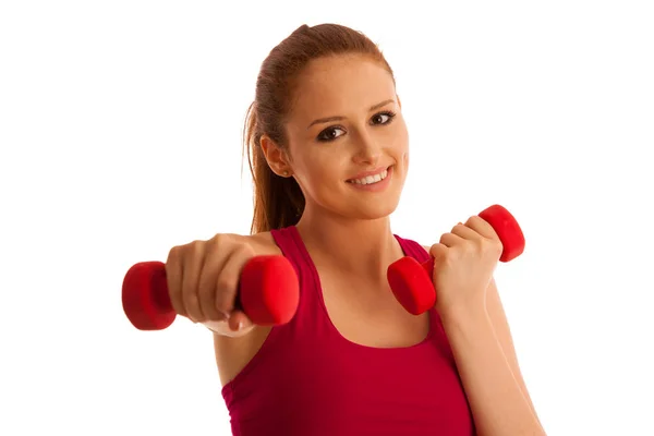 Fitness gym - woman works out with dumbbells isolated over white — Stock Photo, Image