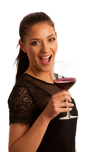Elegantní žena se sklenkou červeného vína — Stock fotografie