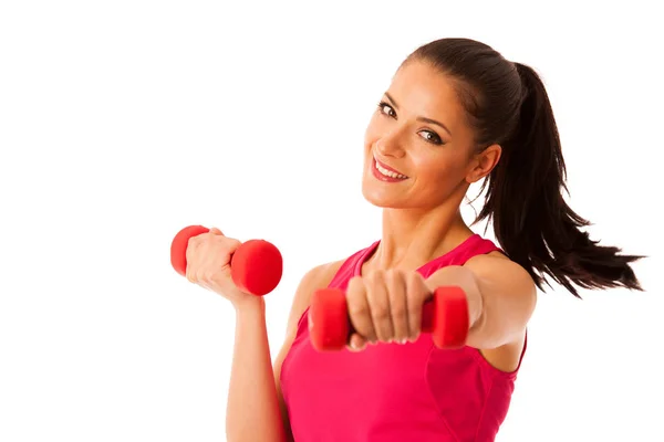 Entrenamiento activo de mujer joven con pesas en gimnasio de fitness aislado —  Fotos de Stock