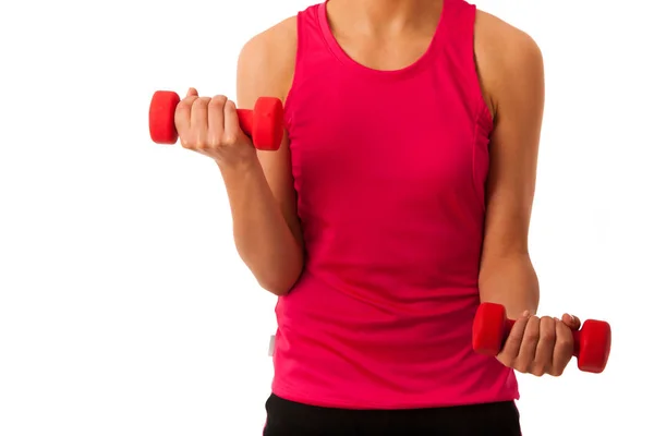 Active young woman workout with dumbbells in fitness gym isolate — Stock Photo, Image