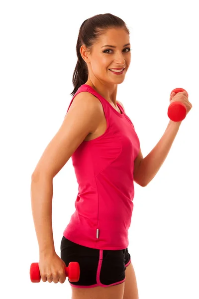 Izolovat aktivní mladá žena cvičení s činkami v posilovně fitness — Stock fotografie