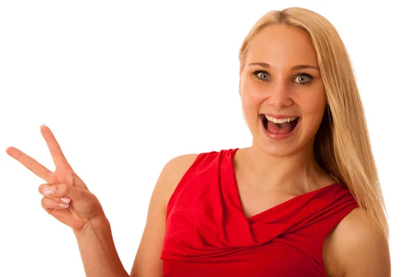Woman in red shows v sign for victory isolated over white — Stock Photo, Image
