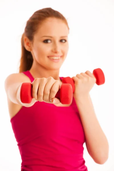 Fitness gym - woman works out with dumbbells isolated over white — Stock Photo, Image