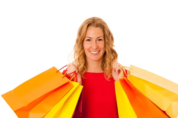 Cutwe brunette vrouw met krullend bruin haar bedrijf boodschappentassen — Stockfoto