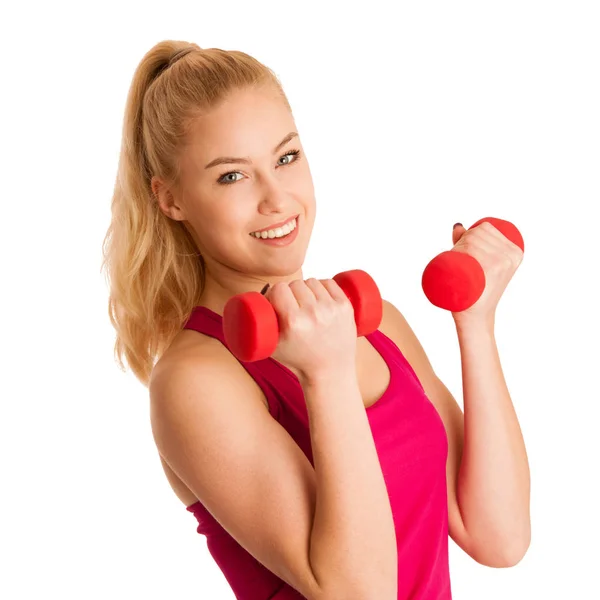 Linda joven rubia haciendo ejercicio en el gimnasio de fitness aislado sobre —  Fotos de Stock