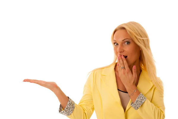 Business woamn adverts a product with her hand extended in copy — Stock Photo, Image