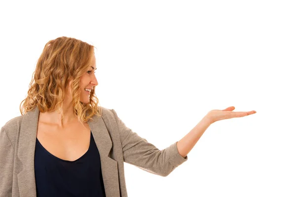 Woman holding arm over copy space as she is advertising a produc — Stock Photo, Image