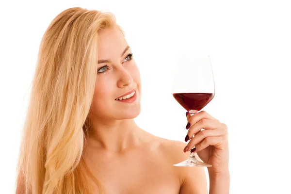 Cute blonde woman drinks a glass of red wine isolated over white — Stock Photo, Image