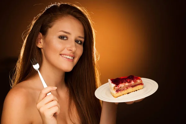 Strawberry cake - wman eats sweet dessert isolated — Stock Photo, Image