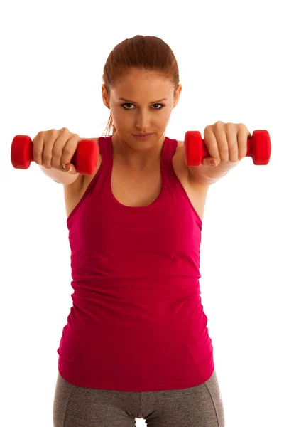 Fitness gym - woman works out with dumbbells isolated over white Stock Image