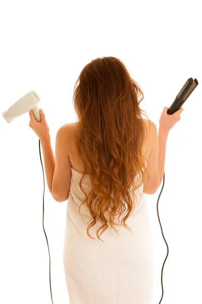 Mulher bonita segura escova de cabelo e secador de cabelo isolado o — Fotografia de Stock
