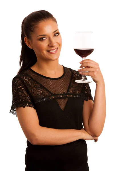 Elegante Frau mit einem Glas Rotwein über Weiß — Stockfoto