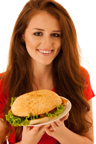不健康餐 幸福的年轻女人吃汉堡包白色孤立 — 图库照片