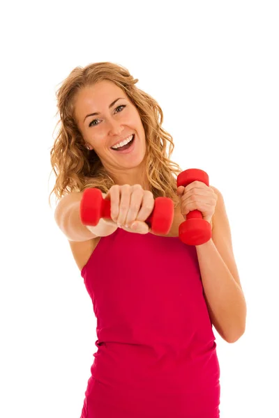 Linda joven rubia haciendo ejercicio en el gimnasio de fitness aislado sobre — Foto de Stock