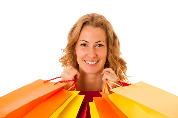 Cutwe morena mujer con pelo castaño rizado sosteniendo bolsas de compras —  Fotos de Stock