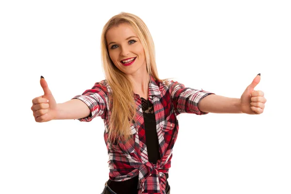 Roztomilá mladá žena v kostkované košili gesta úspěch s zbraní u — Stock fotografie