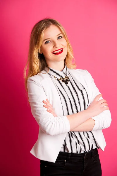 Young business woman in white and black dress over pink backgrou — Stock Photo, Image