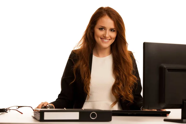 Business woman works in the office checking database on computer — Stock Photo, Image