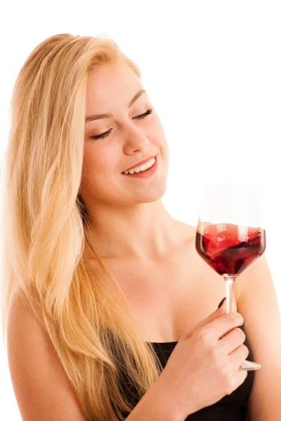 Söt blond kvinna dricker ett glas rött vin isolerade över vita — Stockfoto