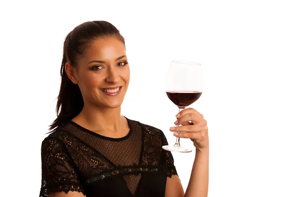 Eleganta kvinnan med ett glas rött vin — Stockfoto
