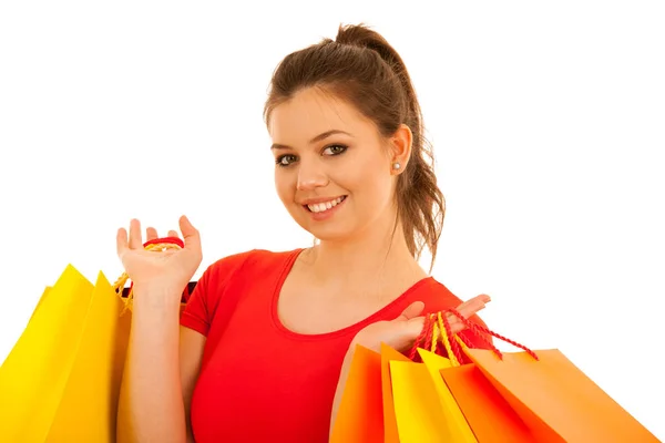 Foto de longitud completa de la mujer sosteniendo bolsas de compras aisladas sobre fondo blanco —  Fotos de Stock