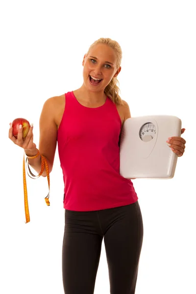 Fit Kobieta blonde holding skali skrzyżowane zdrowego stylu życia i w — Zdjęcie stockowe