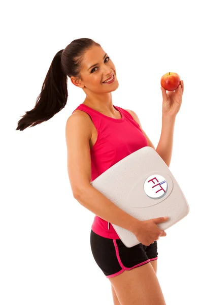 Mulher segurando escala e maçã para um estilo de vida saudável e nutritio — Fotografia de Stock