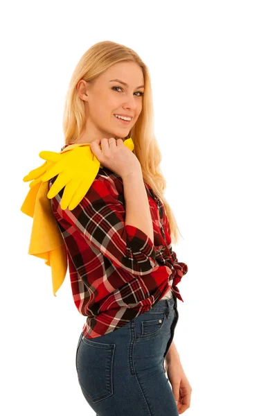 Молодая блондинка с желтыми резиновыми перчатками — стоковое фото
