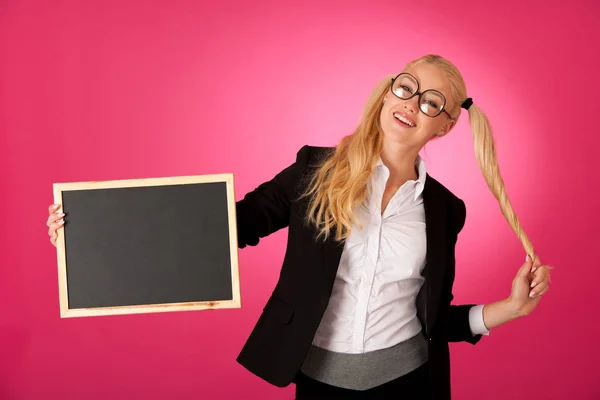 Funky business woman holding a blank blackboard - teacher — Stock Photo, Image