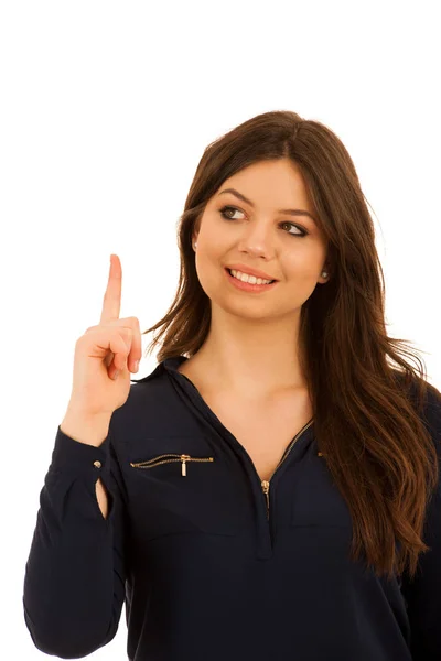 Attractive young woman pointing to copy space isolated over whit — Stock Photo, Image