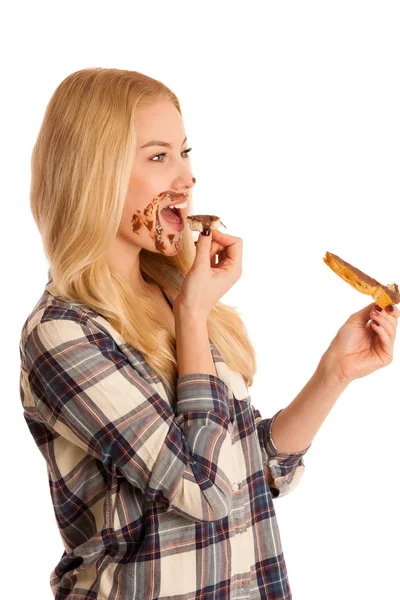 Mujer rubia joven comiendo pan de desayuno y turrón isola propagación — Foto de Stock