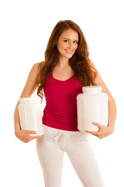 Atractiva hermosa mujer deportiva sostiene en blanco proteína de plástico co —  Fotos de Stock