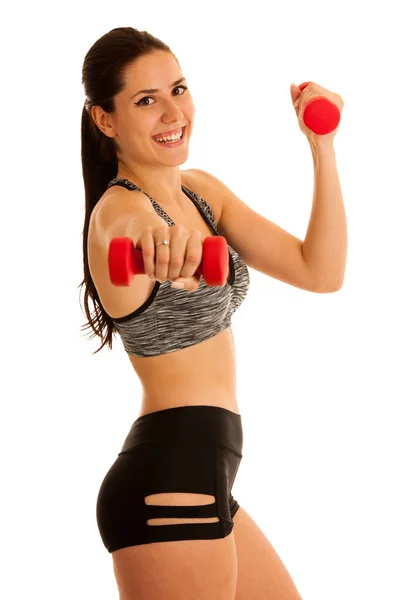 Fitness salonunda dumbbells ile aktif genç kadın wprkout — Stok fotoğraf