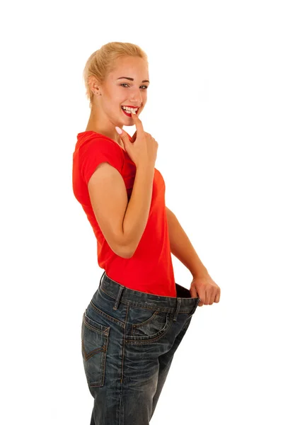 Active young woman gesture weight loss isolated over white backg — Stock Photo, Image