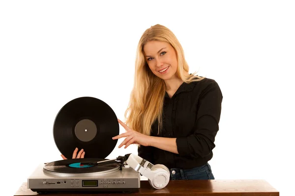 Woman listening music on gramophone with vinyl in her hands isol — Stock Photo, Image