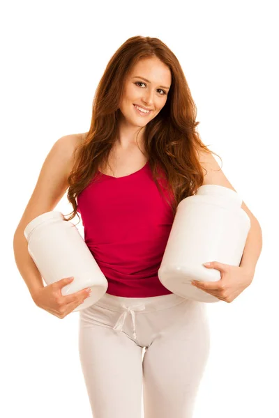 Atractiva hermosa mujer deportiva sostiene en blanco proteína de plástico co — Foto de Stock