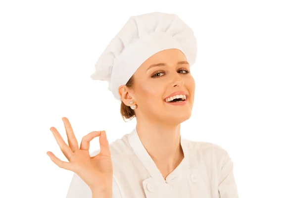 Hermosa mujer joven chef gestos excelente aislado sobre blanco — Foto de Stock