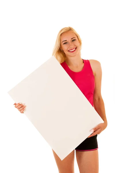 Mulher esportiva ativa mantém banner branco com espaço de cópia para addit — Fotografia de Stock
