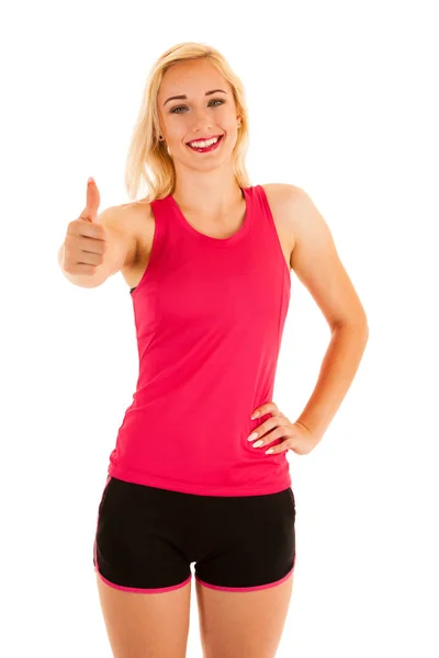 Active blonde sporty woman shows thumb up as a gesture for succe — Stock Photo, Image