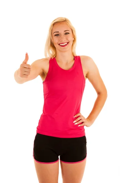 Active blonde sporty woman shows thumb up as a gesture for succe — Stock Photo, Image