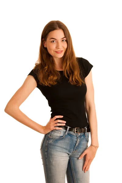 Attractive young woman in jeans and black t shirt isolated over — Stock Photo, Image